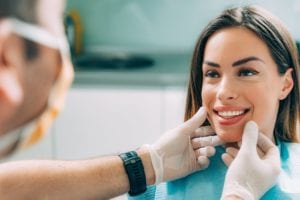 Woman having her smile examined by a dentist