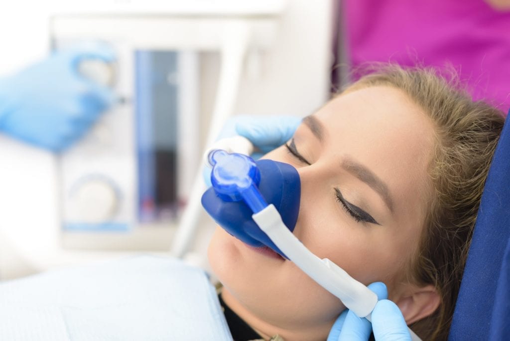 woman receiving nitrous oxide sedation