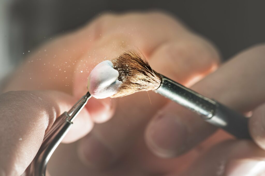 porcelain dental crown being polished